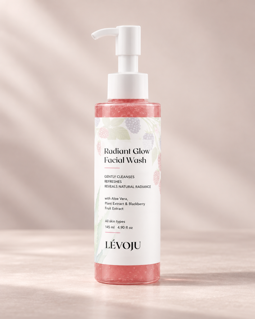 LÉVOJU Radiant Glow Facial Wash, 145 ml pump bottle with pink cleanser on a blush background